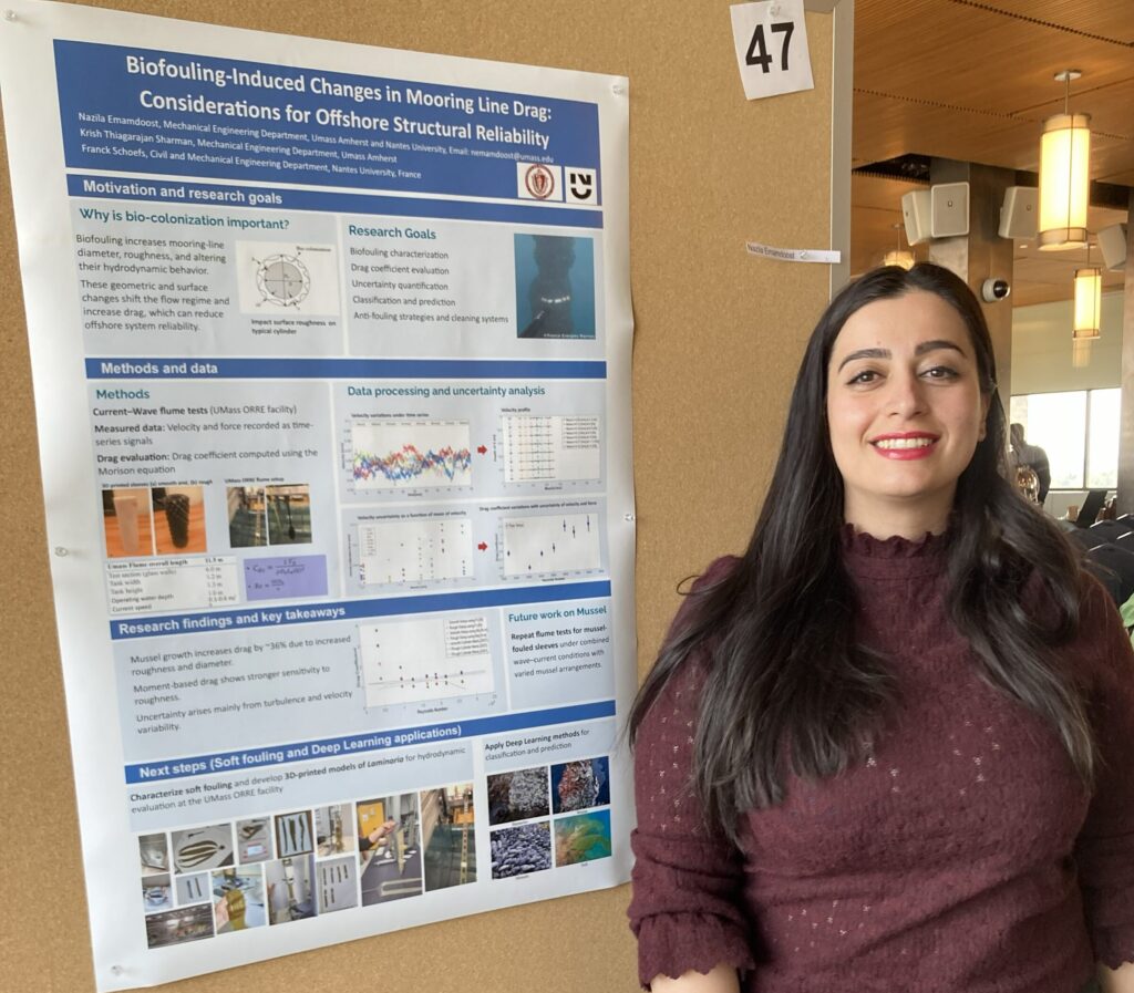 Nazila Emamdoost stands next to her poster at the 2026 Energy Transition Symposium